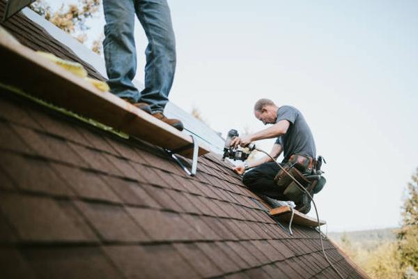 Roofing Contractor Tips for Ada Homeowners During Storm Season